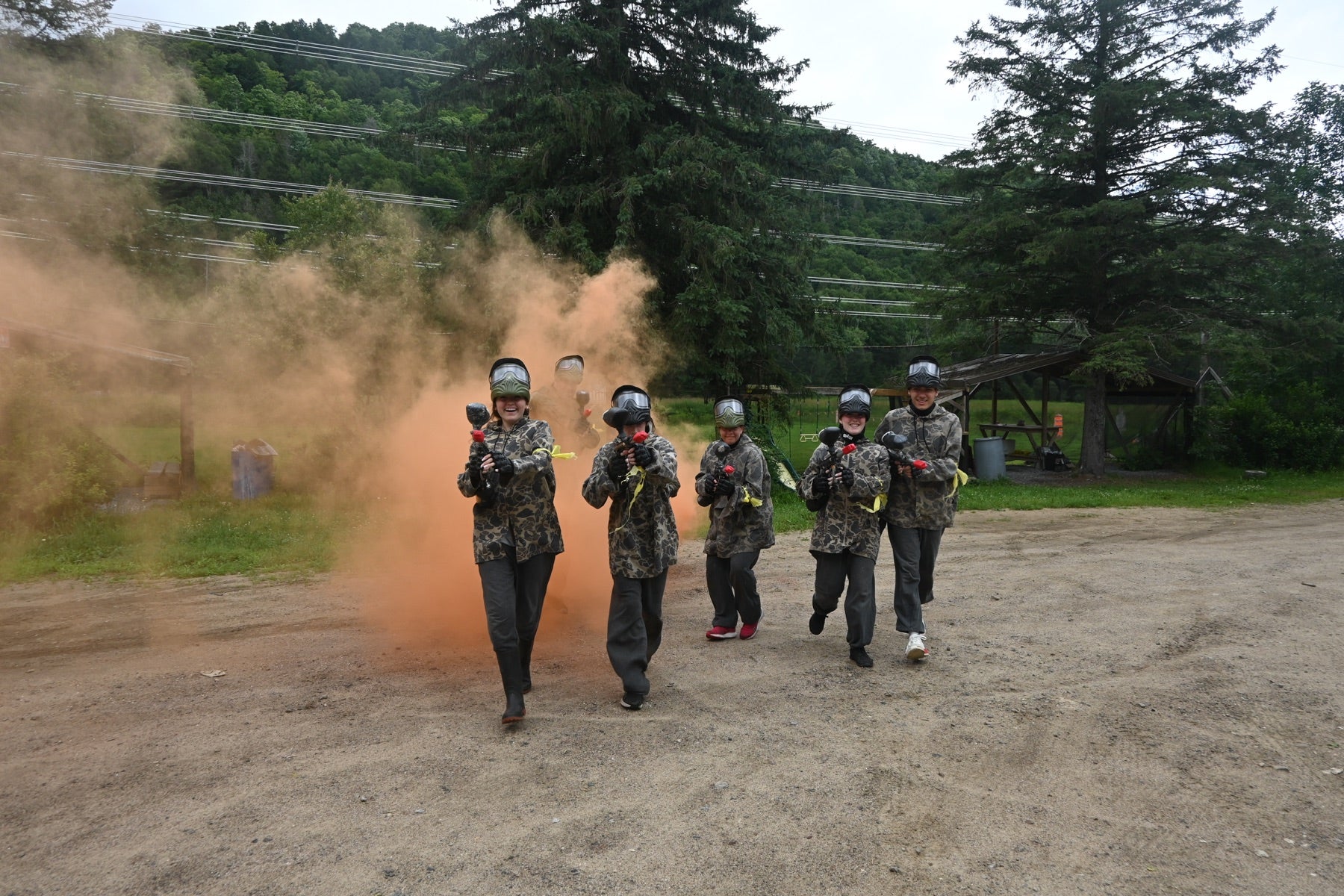 Young paintball players ready to play as a team
