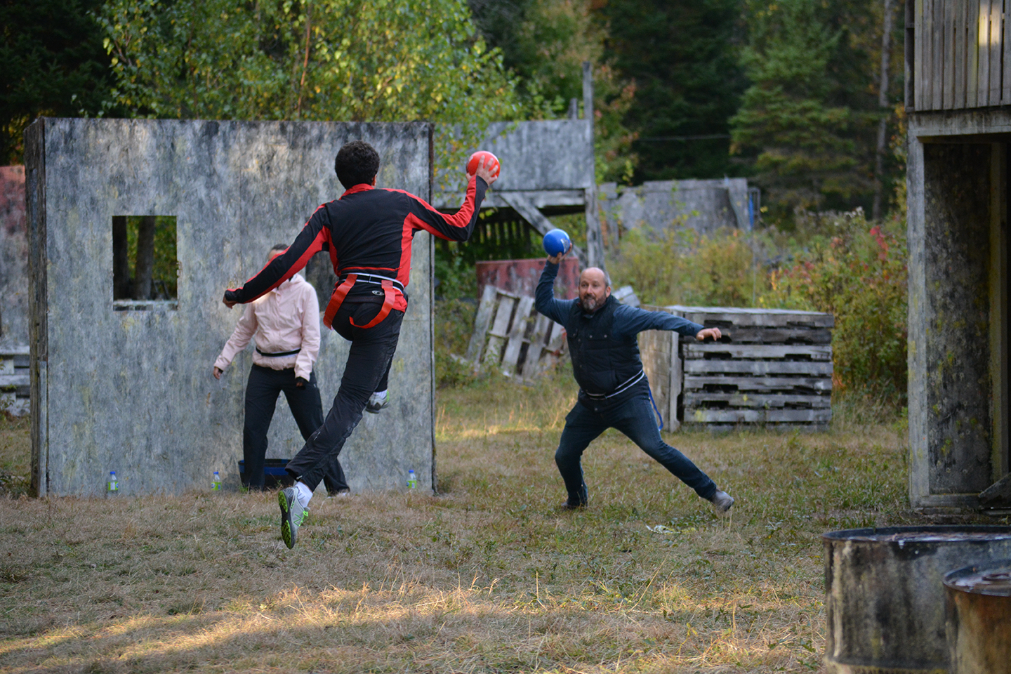 Friends playing Grab or Tag outdoors at Fort Ouest