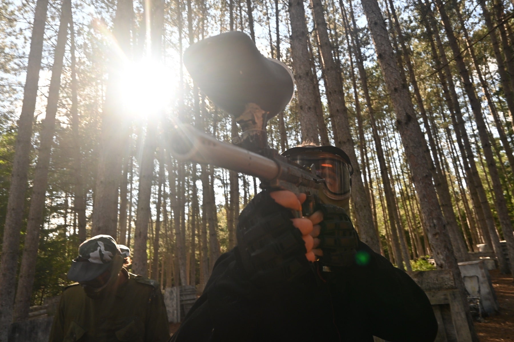 Paintball player in the forest at Fort Ouest