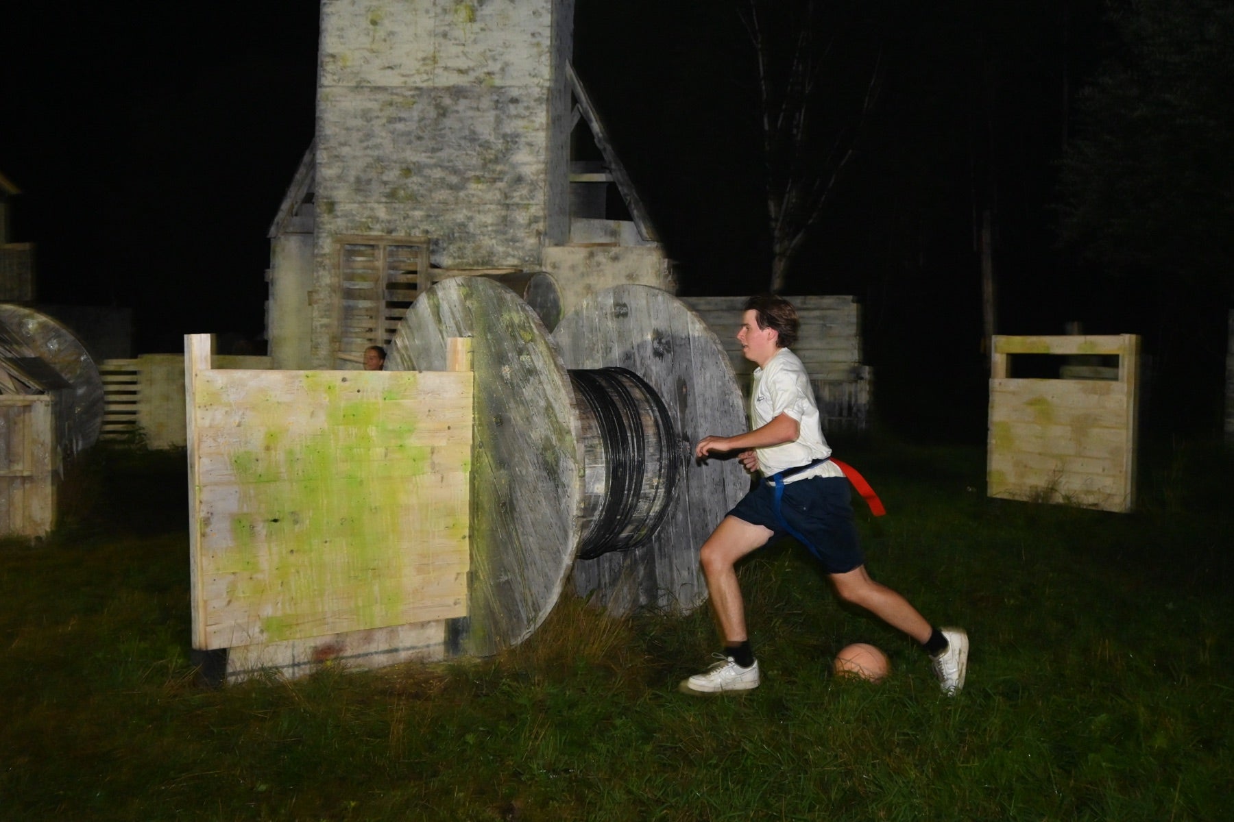Grab or Tag player running through a Fort Ouest field at night